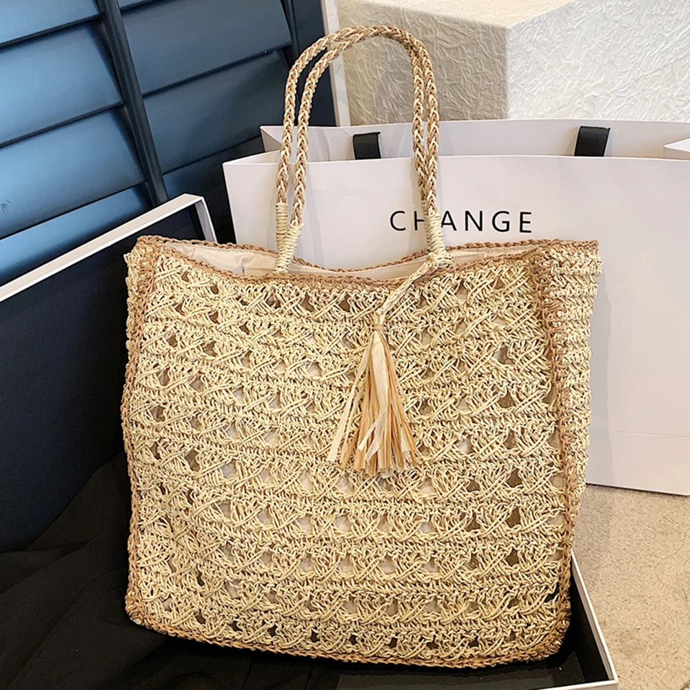 Hollow out tassel weaving straw handbag
